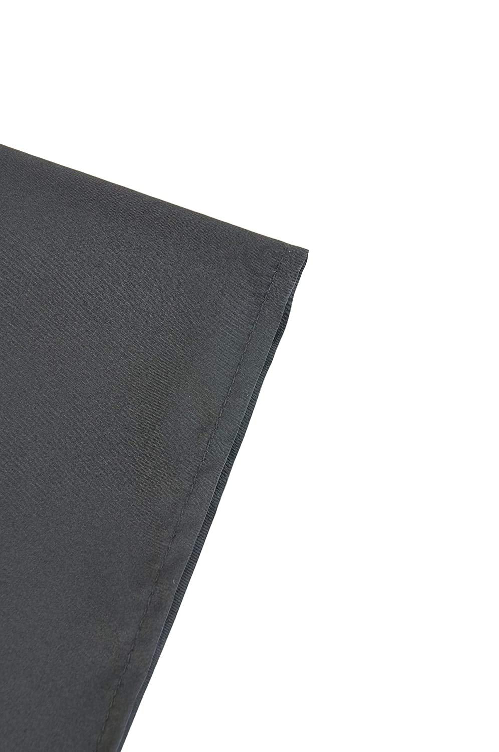 Close-up of the stitched hem on the black nylon styling cape