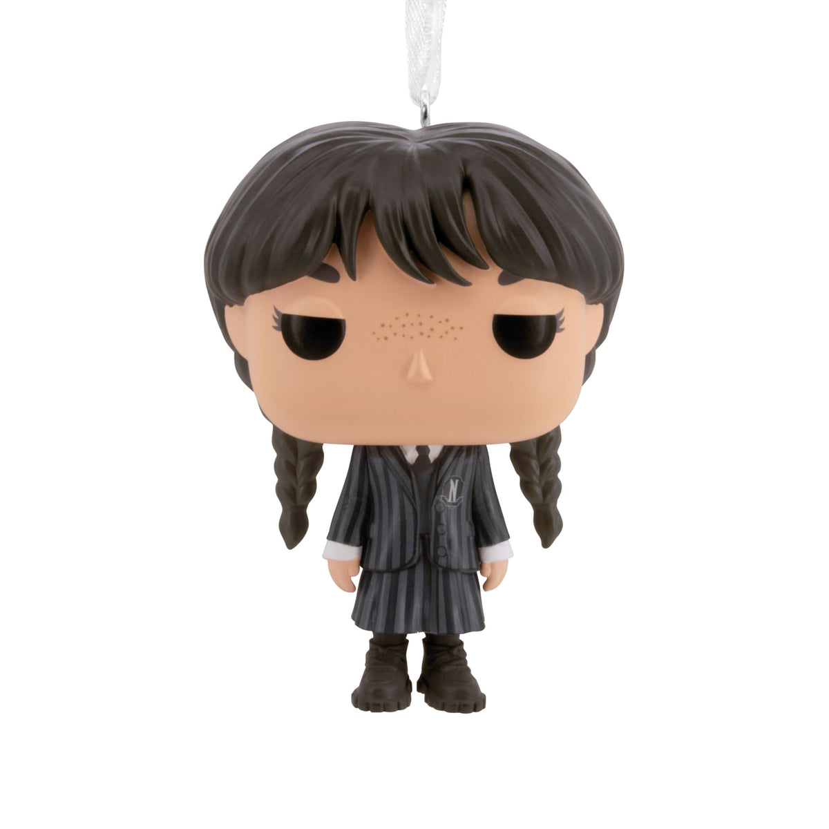 Big-head vinyl ornament of a freckled girl with dark braids in a pinstripe school blazer