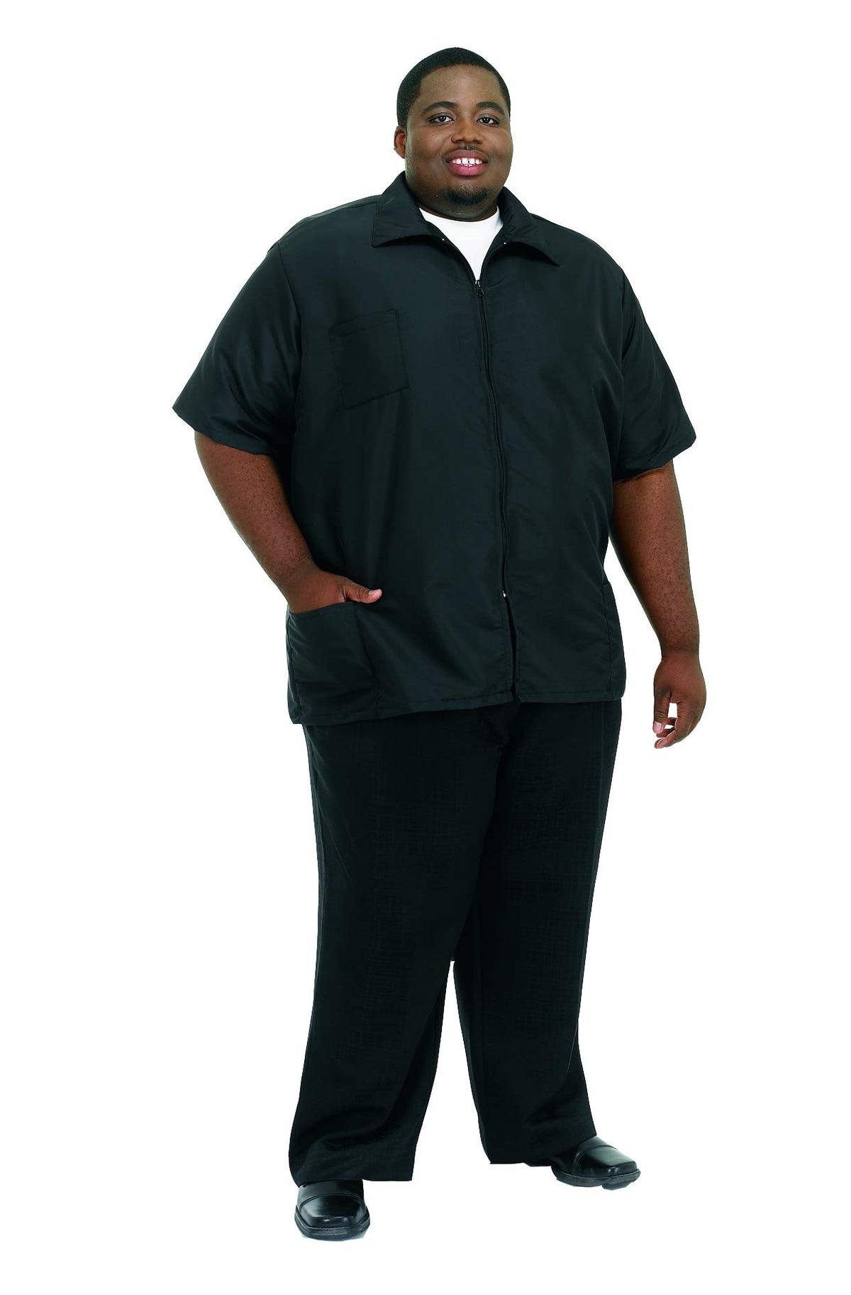 Smiling man wearing a black short-sleeve zip-front barber jacket with chest and hip pockets