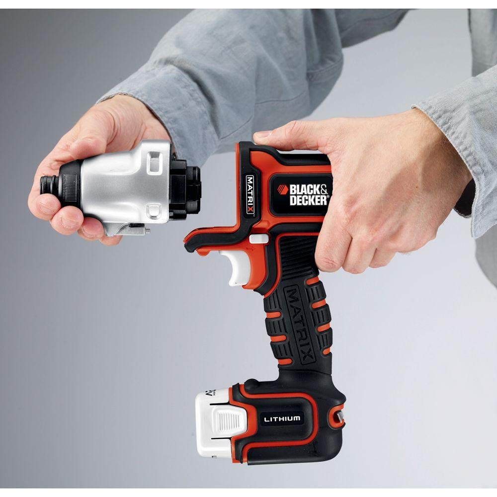 Hands fitting the silver impact attachment onto an orange and black Matrix drill base