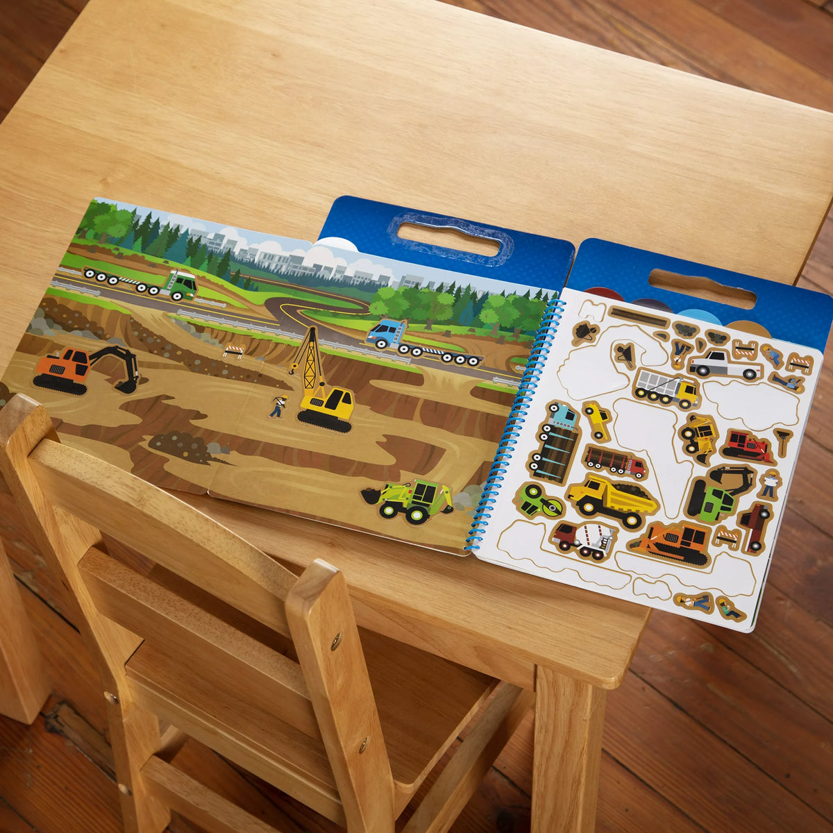 Construction scene filled with digger and crane stickers on a kids' table