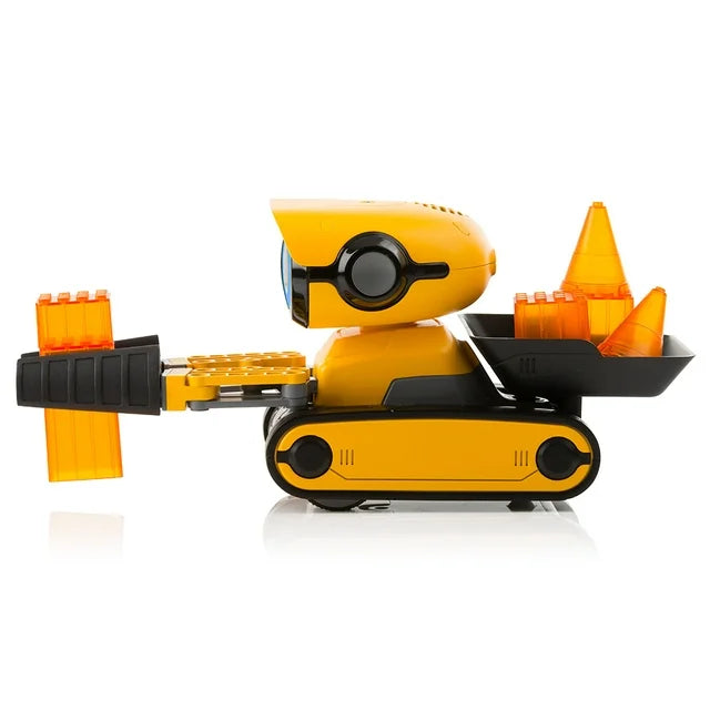Side view of the robot holding orange blocks out front, cones in its rear bucket