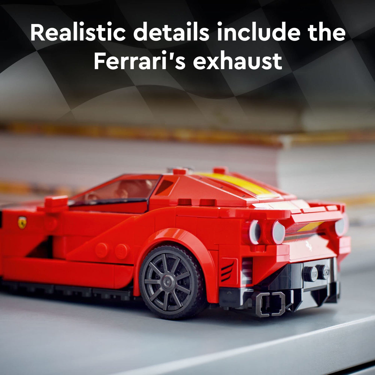 Rear view of the red brick-built supercar showing tail lights and twin exhaust
