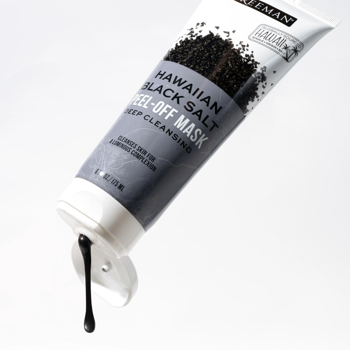 Angled black salt mask tube with thick black gel dripping from the cap