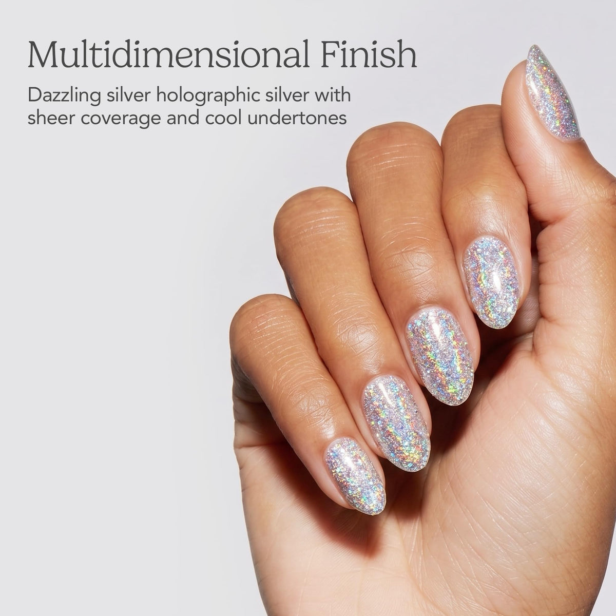 Hand with almond nails in dazzling silver holographic glitter polish