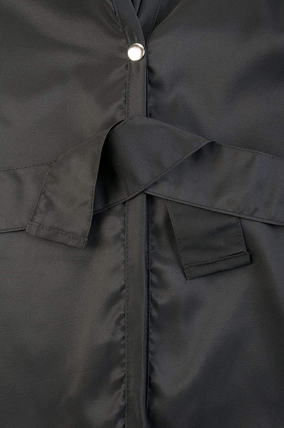 Close-up of the attached black tie belt below the snap closure