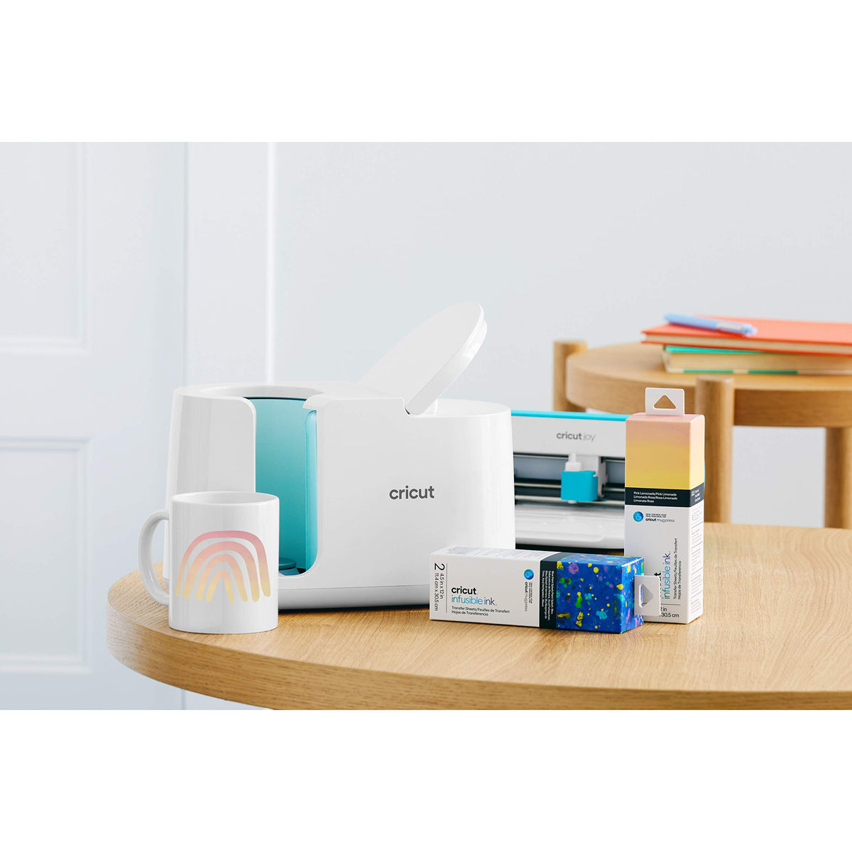 Cricut Mug Press with a rainbow mug, Cricut Joy cutter and Infusible Ink sheets