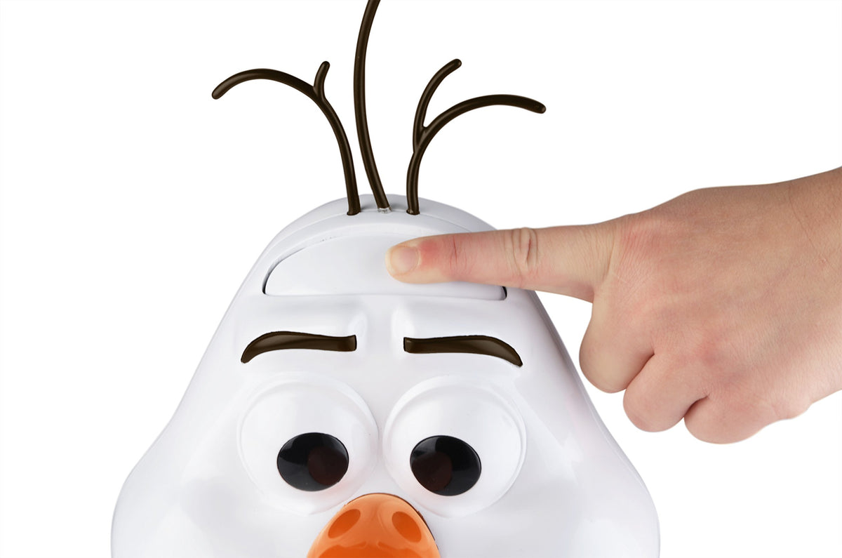 Finger pressing the button on top of Olaf's head below his twig hair