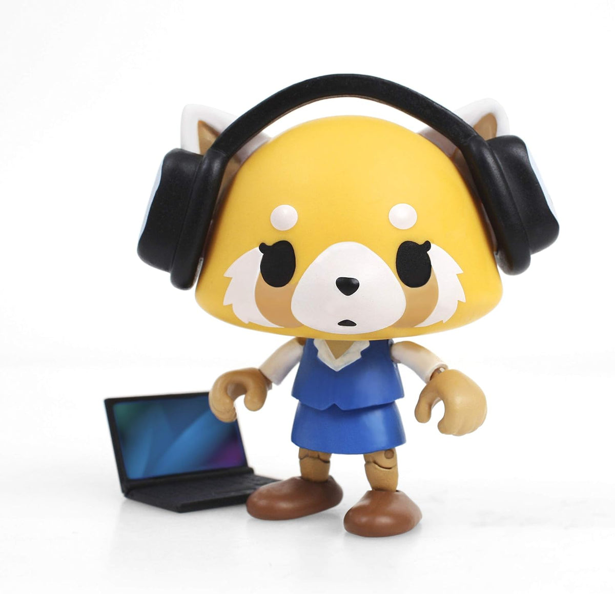 Red panda figure in a blue office dress and black headphones beside a laptop