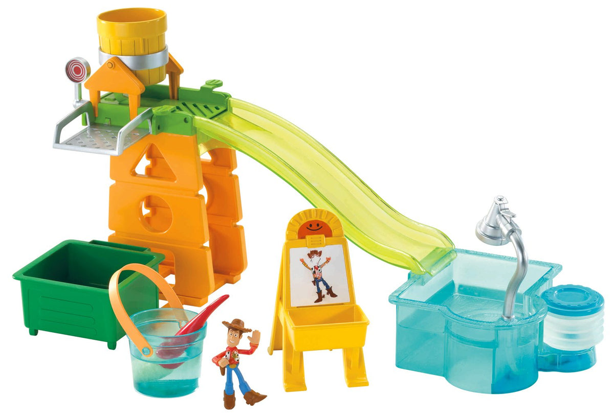 Toy Story playground playset with orange tower, green slide, pool, easel and Woody figure
