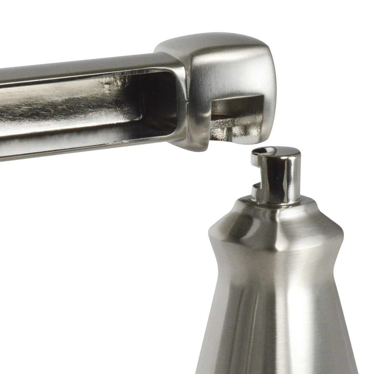 Close-up of the brushed nickel holder arm lifting off its pivot post