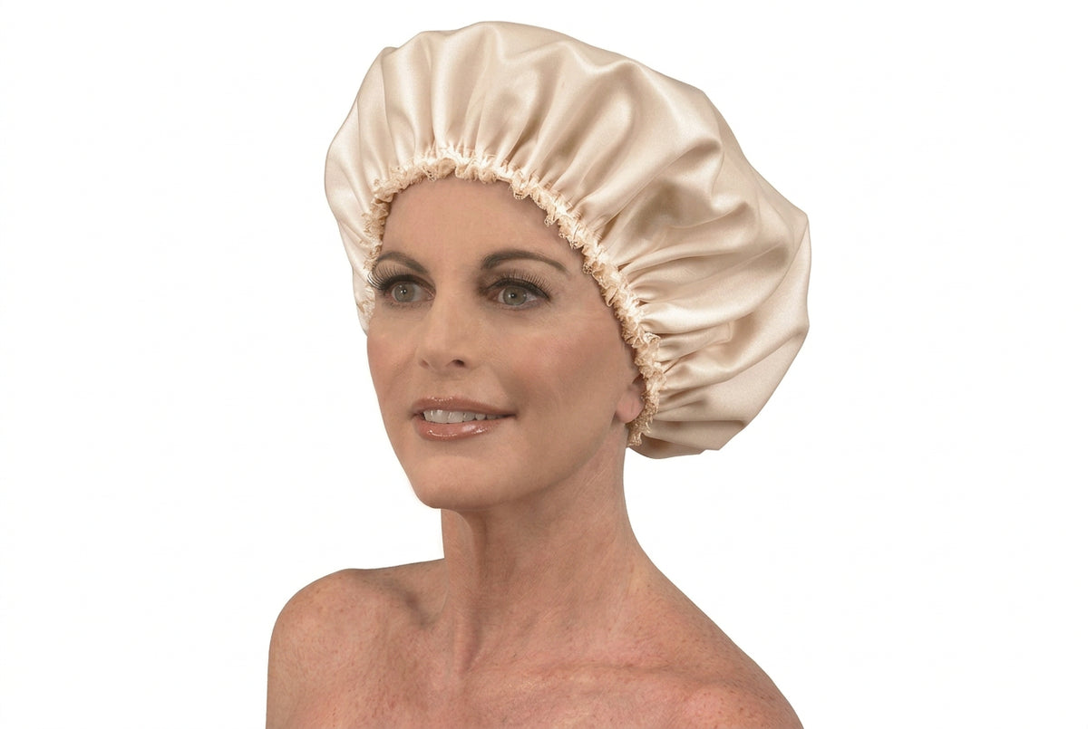 Woman wearing a gathered satin sleep cap with a lace-trimmed elastic edge