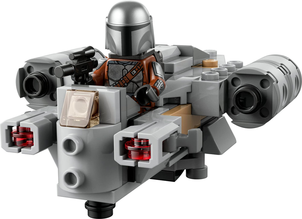 Grey Razor Crest microfighter with the Mandalorian minifigure holding a blaster in the cockpit