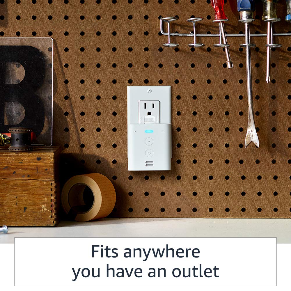 Echo Flex plugged into an outlet on a workshop pegboard wall with tools