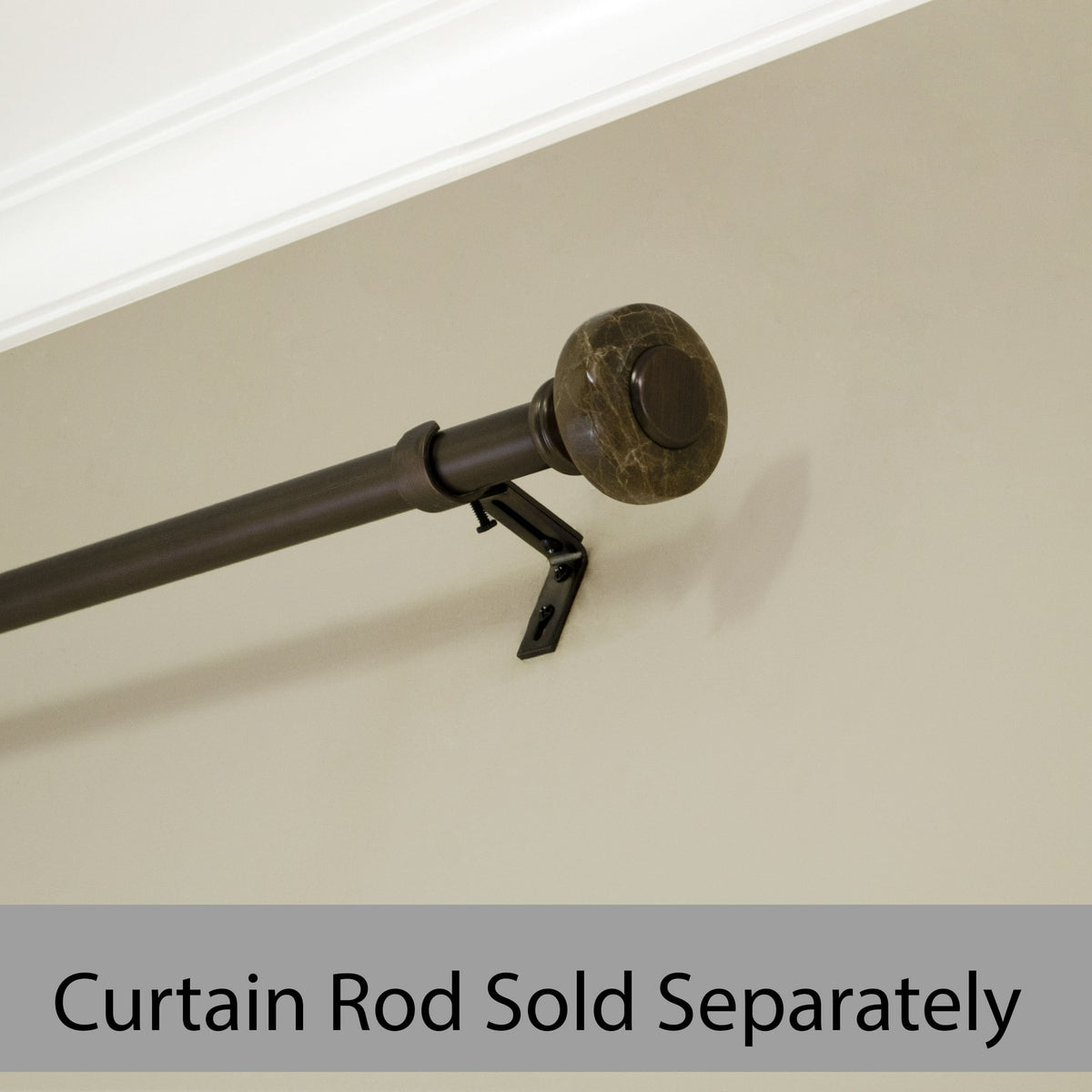 Brown marble-effect knob finial on a bronze curtain rod mounted on a wall bracket