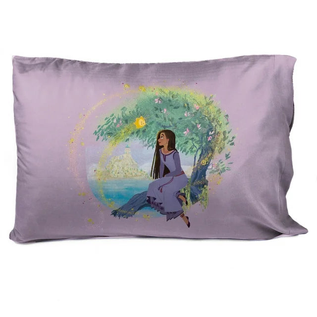 Pillowcase back showing Asha sitting under a tree by the sea