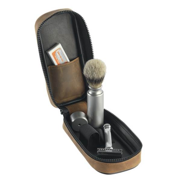 Open tan leather zip case with safety razor, badger brush, blades and stand