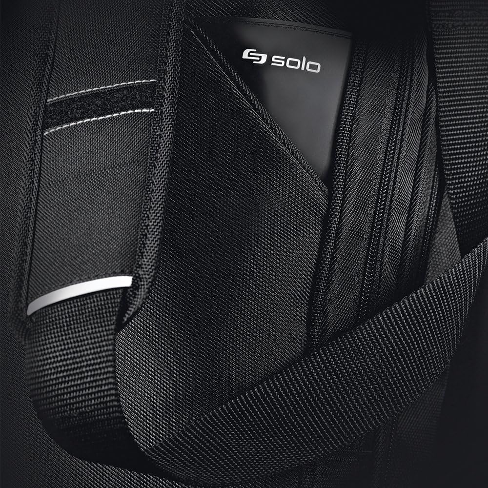 Close-up of black ballistic nylon pocket holding a phone with a reflective trim strip