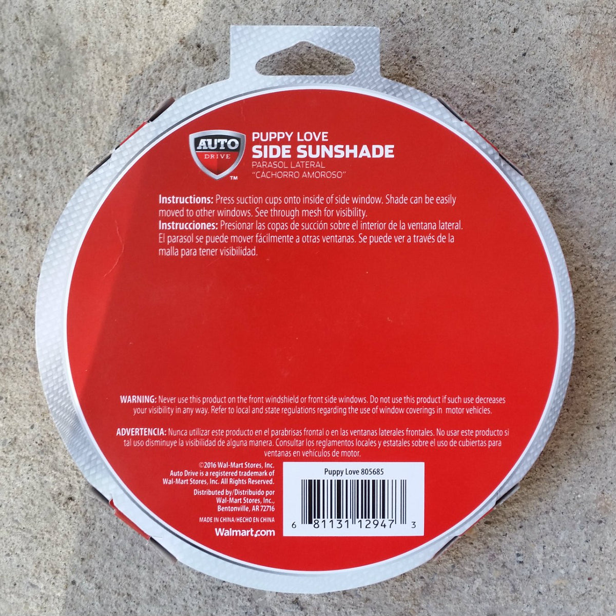 Back of the round red sunshade pack with instructions, warning and barcode