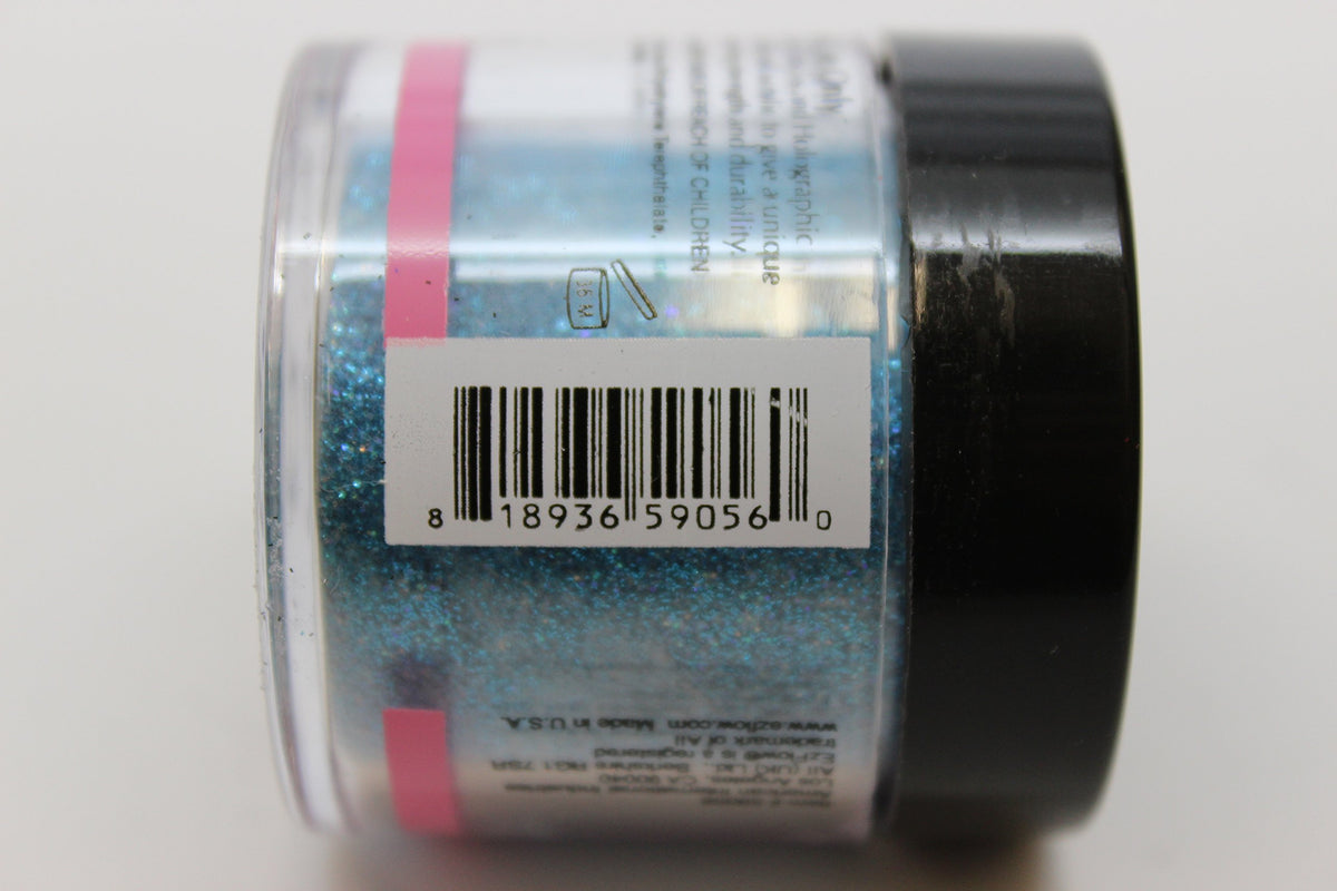Side of the blue holographic glitter powder jar showing its barcode label