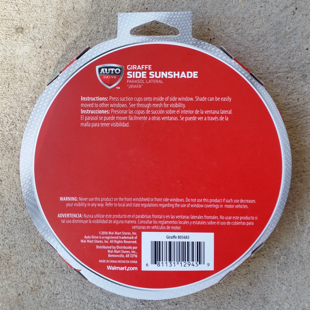 Back of the round red sunshade package with instructions and warning