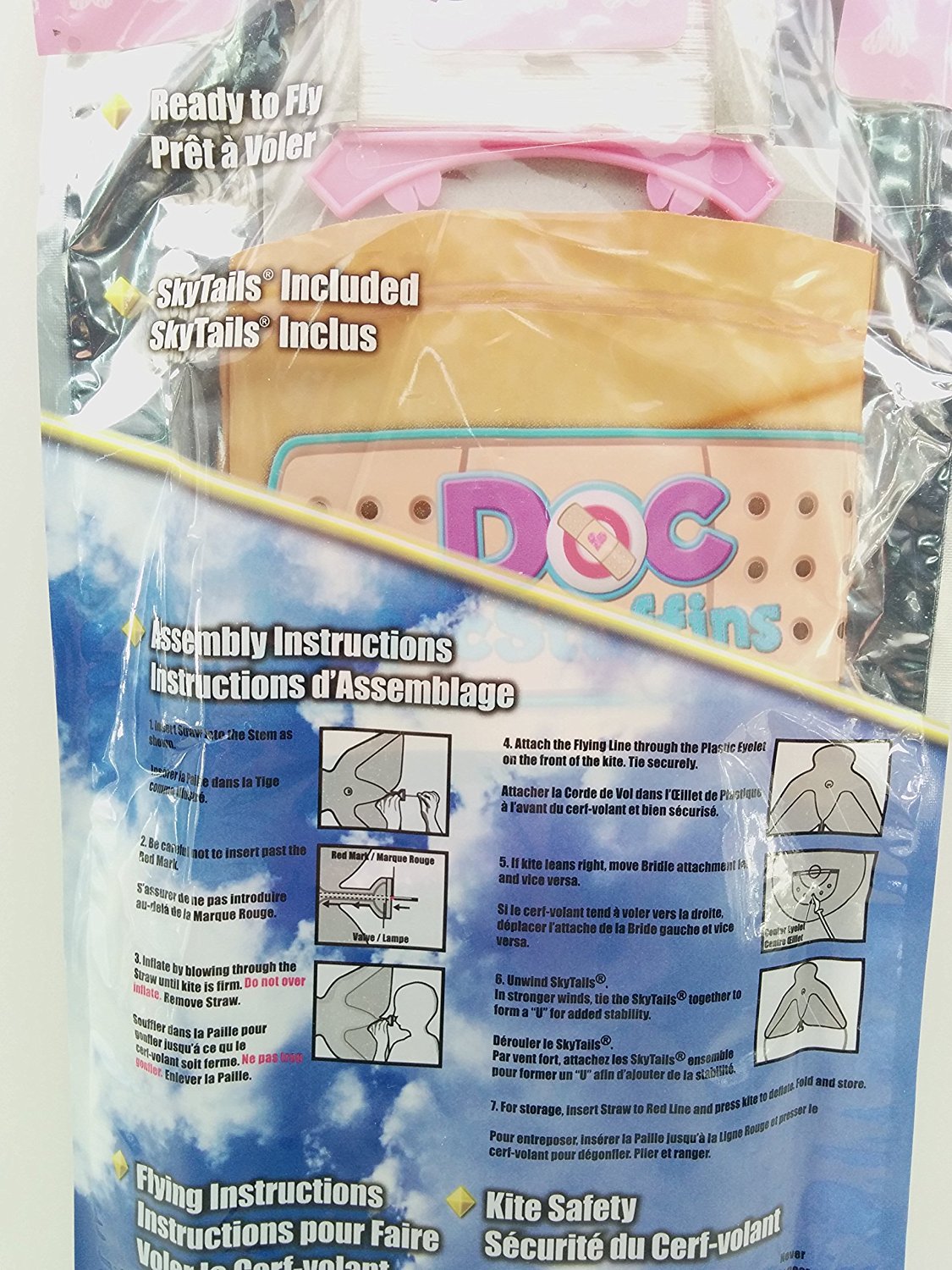 Back of the kite package with assembly steps and the bandage-print kite visible inside