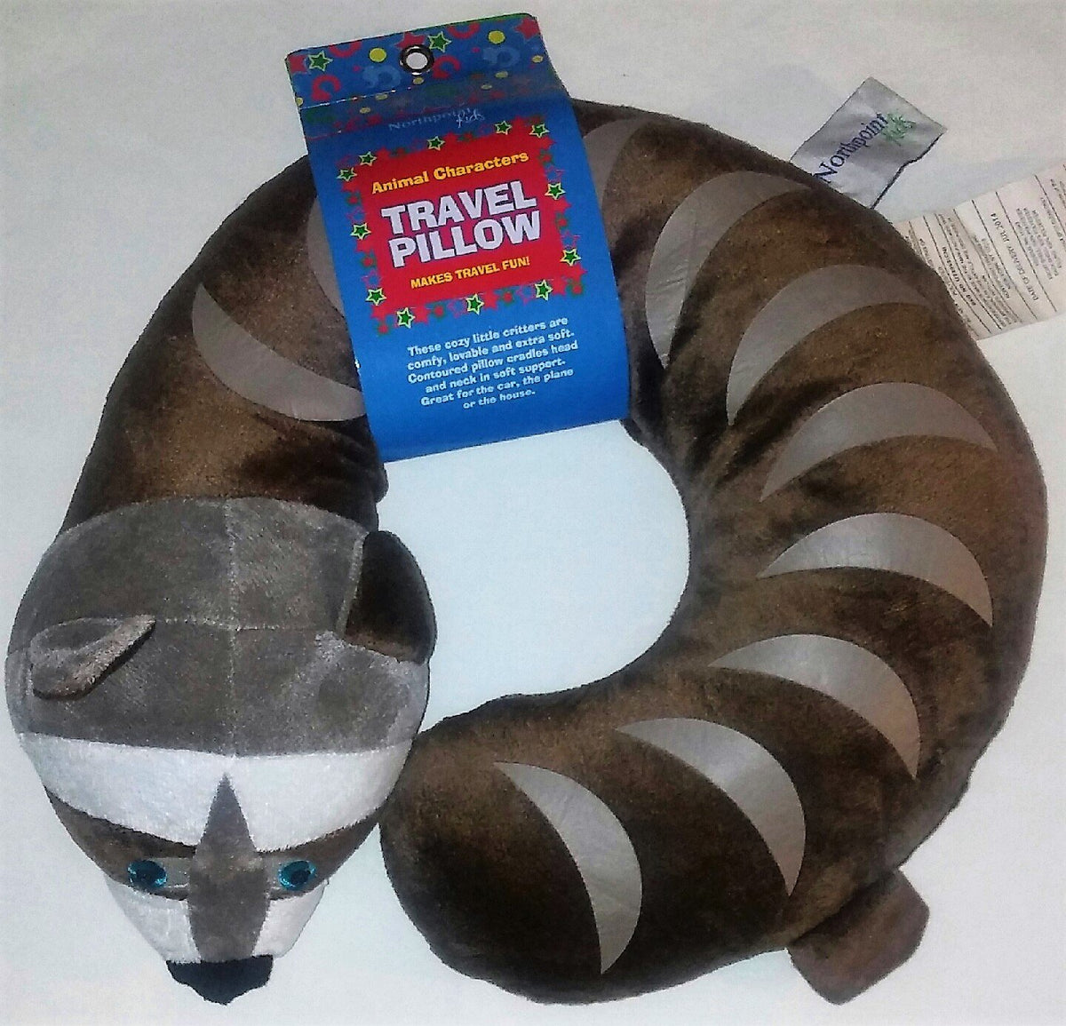 Raccoon travel pillow curled in a U shape with its Animal Characters tag