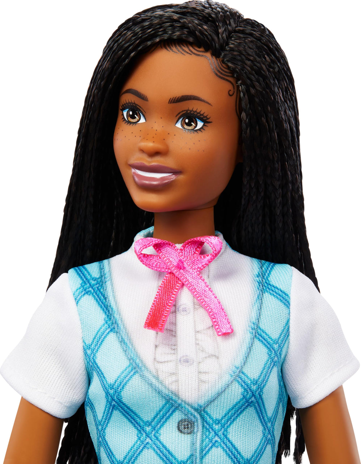 Close-up of the Brooklyn doll's face, long black braids, freckles and pink ribbon bow