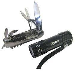 Silver folding multi-tool with blades and scissors beside a black LED flashlight with wrist strap