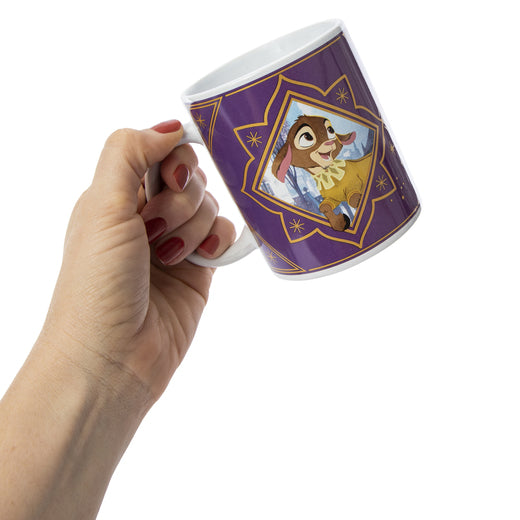 Hand holding the purple mug showing Valentino the goat on the other side