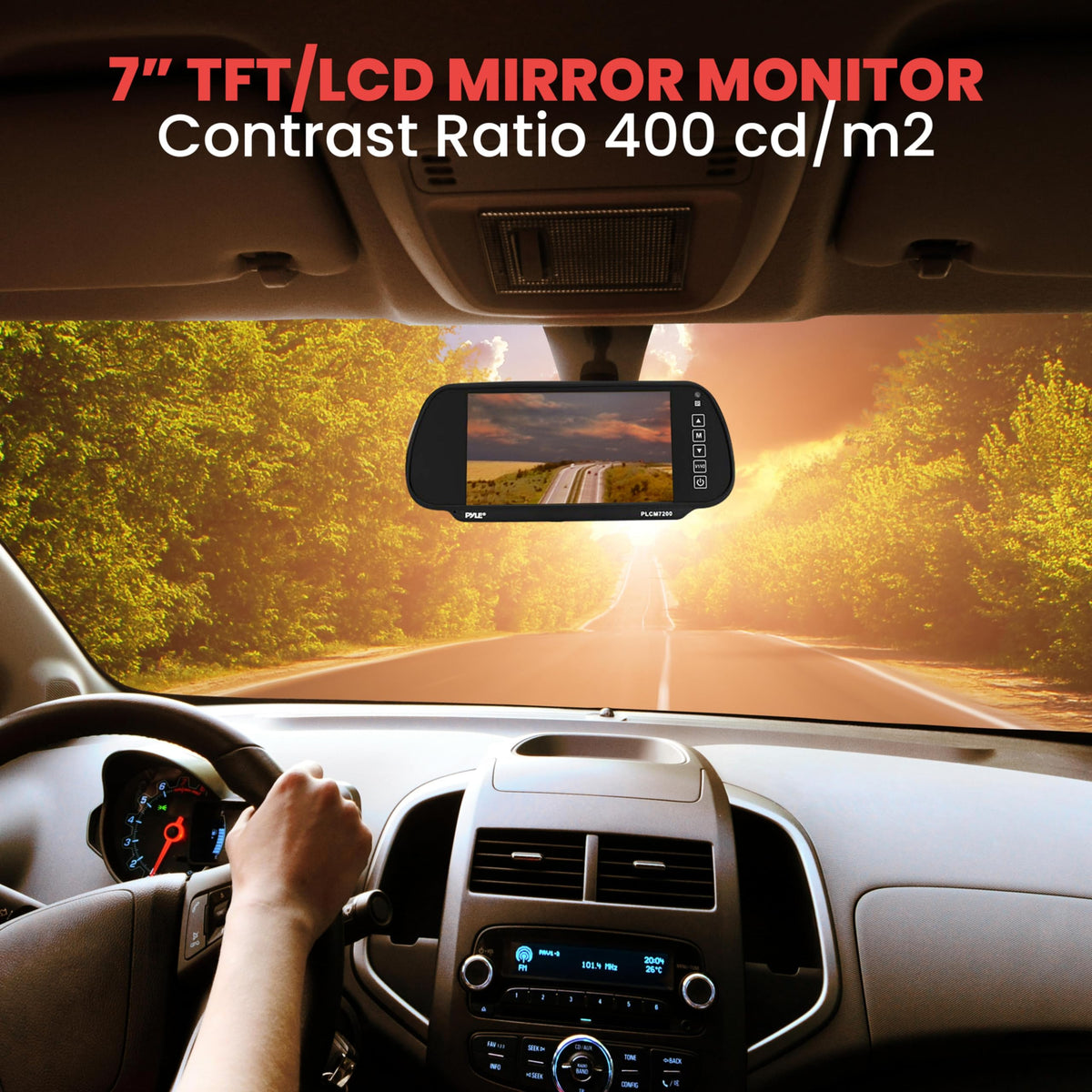 Mirror monitor clipped over a car rear-view mirror above a sunny tree-lined road