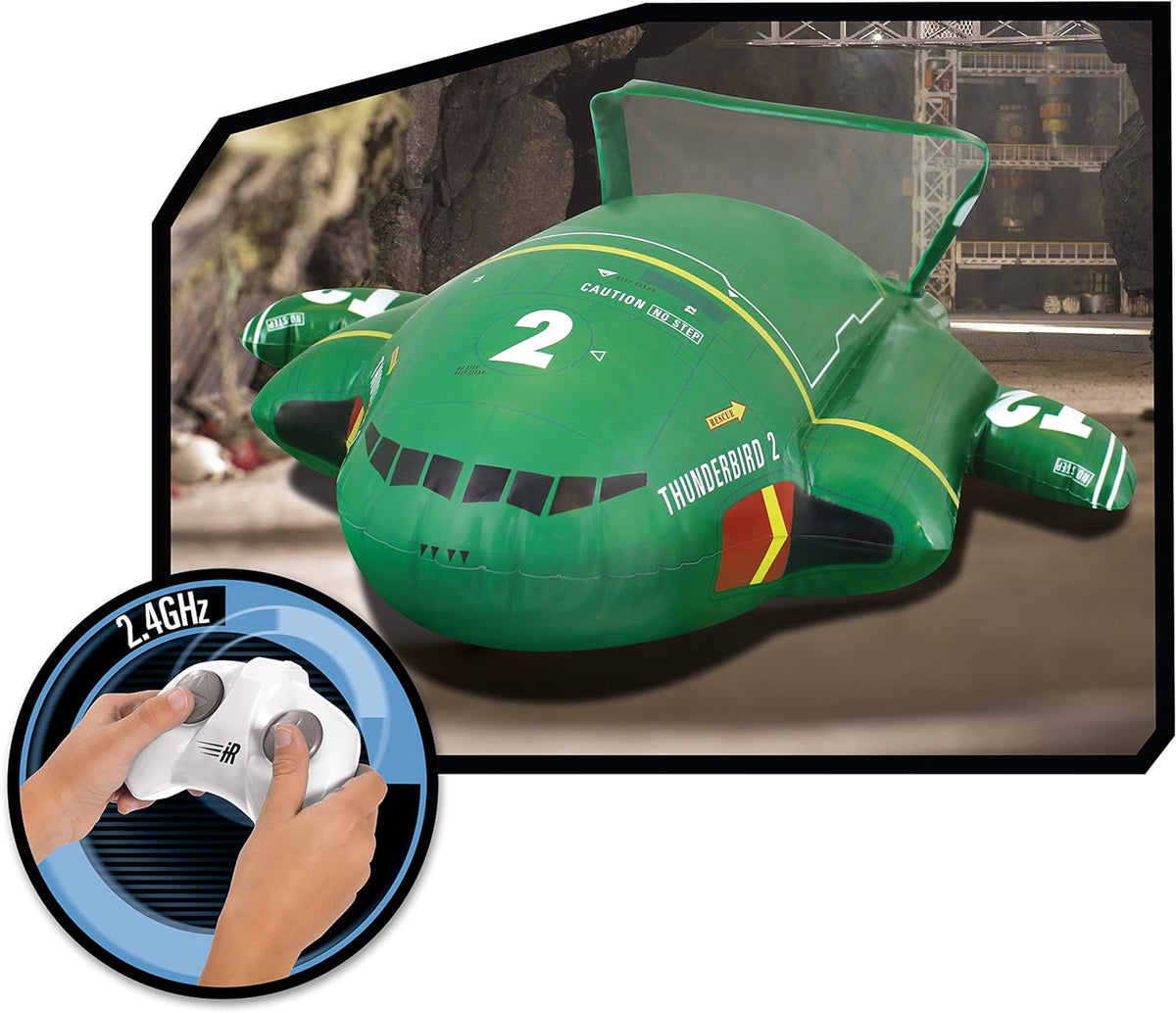 Thunderbird 2 inflatable in a hangar scene with a hand using the 2.4GHz remote
