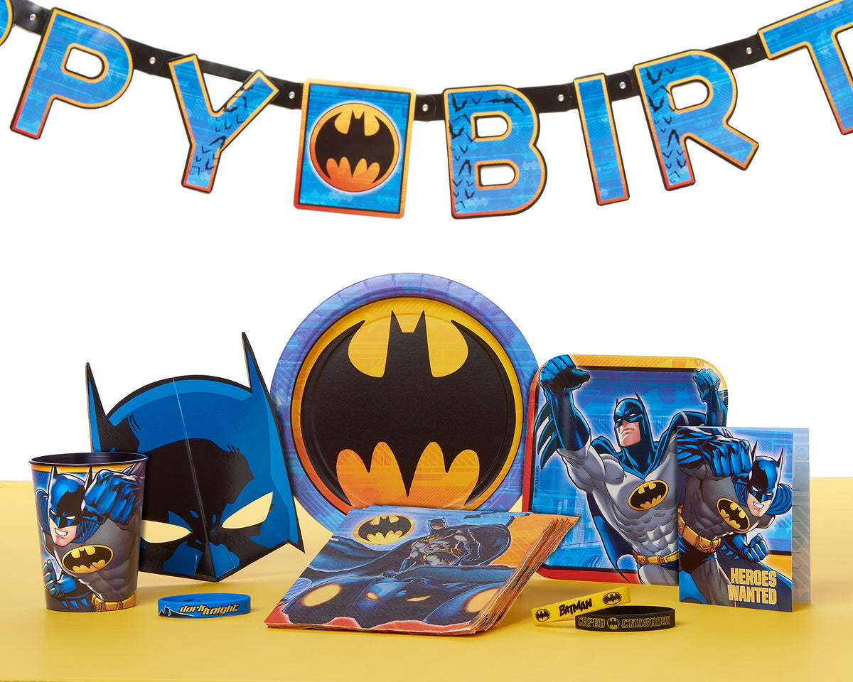 Batman party table with plates, napkins, cup, mask, wristbands, invitation and birthday banner
