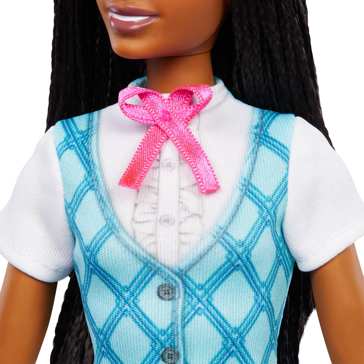 Close-up of the doll's blue argyle riding vest, white shirt and pink satin bow