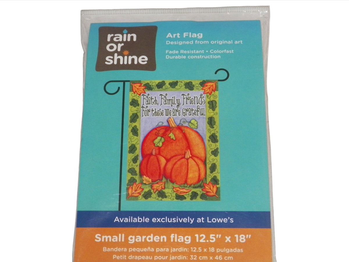 Packaged autumn garden flag with three orange pumpkins and Faith Family Friends text
