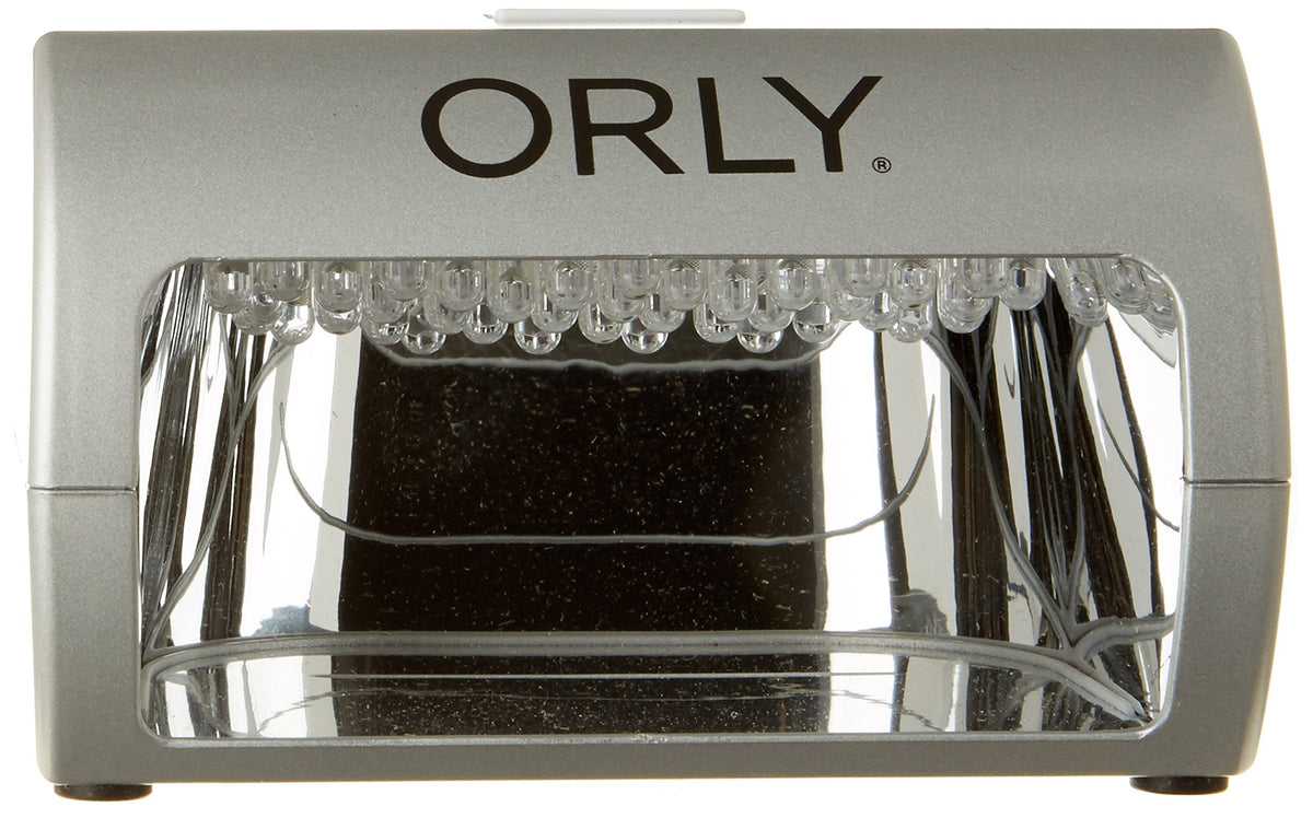 Front of a compact silver LED nail lamp with a mirrored chamber and rows of LEDs