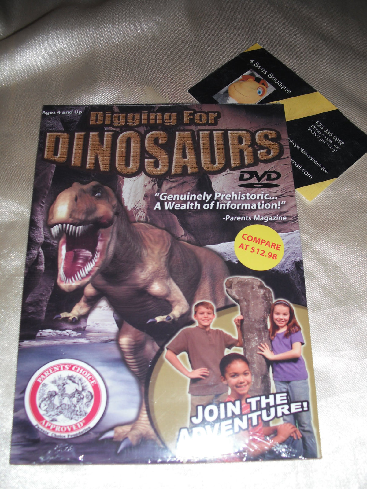 Sealed Digging for Dinosaurs DVD with a roaring T. rex and three kids by a fossil
