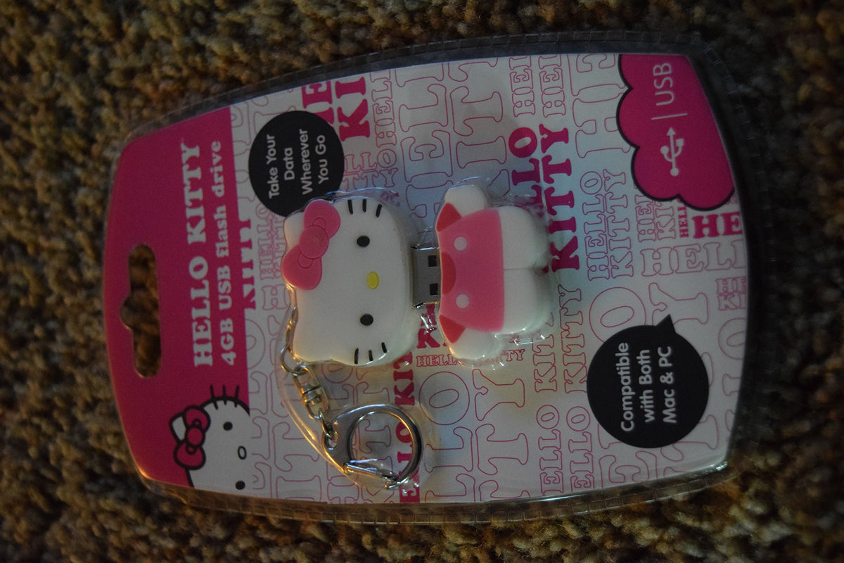 Hello Kitty head 4GB USB drive keychain with pink bow in its pink blister pack