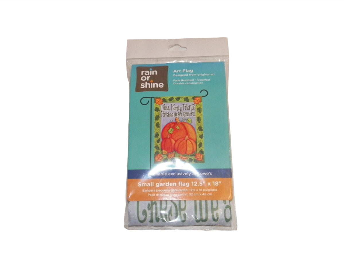 Full view of the packaged pumpkin flag, small garden flag 12.5 by 18 inches