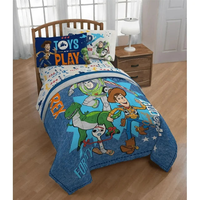 Toy Story comforter on a wooden bed with Toys at Play pillowcases