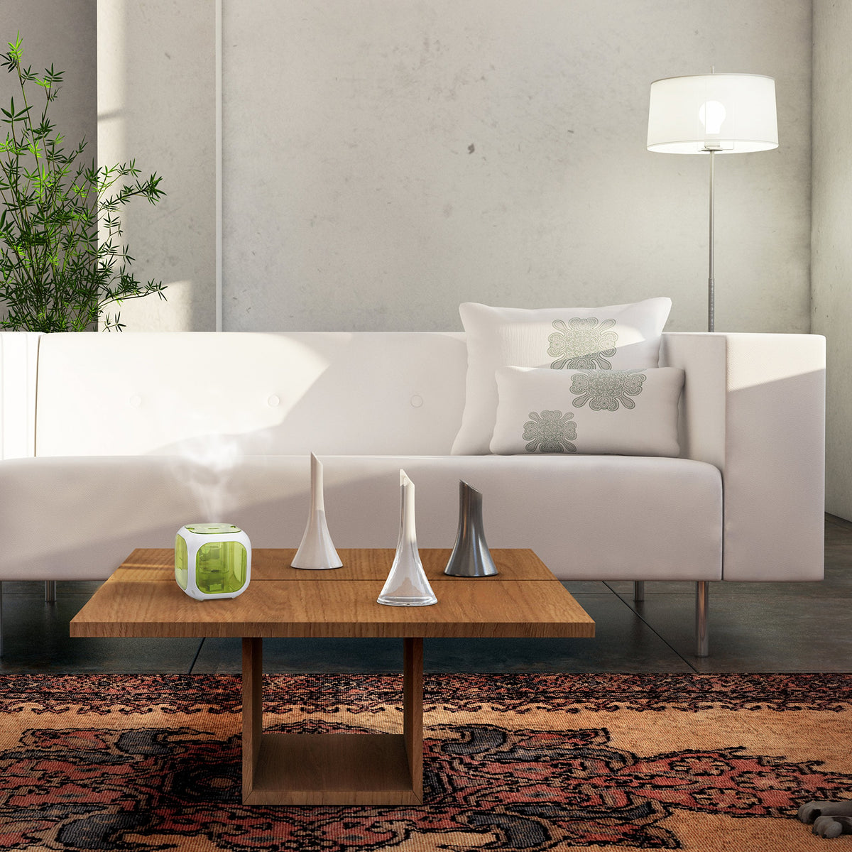 Green cube humidifier releasing mist on a wooden coffee table in front of a white sofa