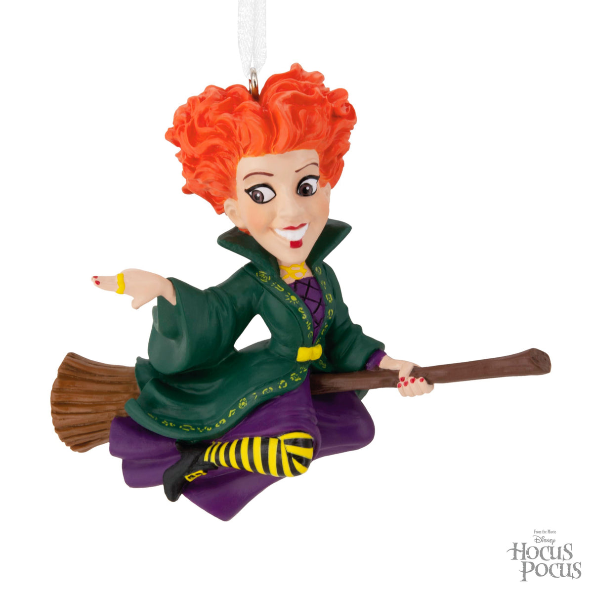 Red-haired witch on a broom in green and purple with yellow striped stockings