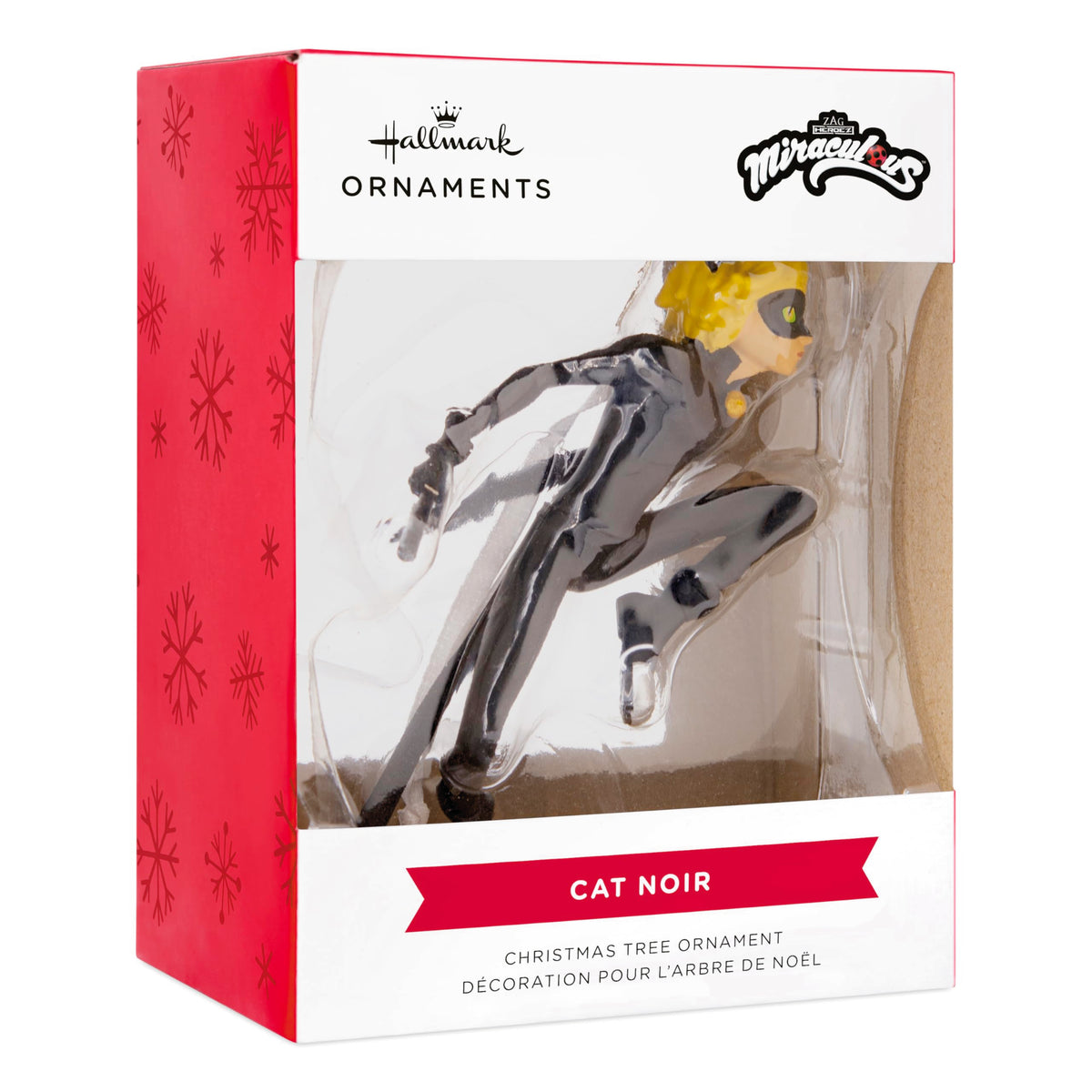 Cat hero ornament in its red and white snowflake window box