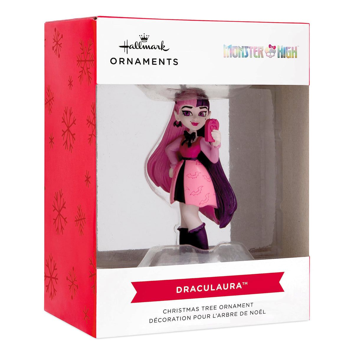 Vampire girl ornament in its red and white snowflake window box