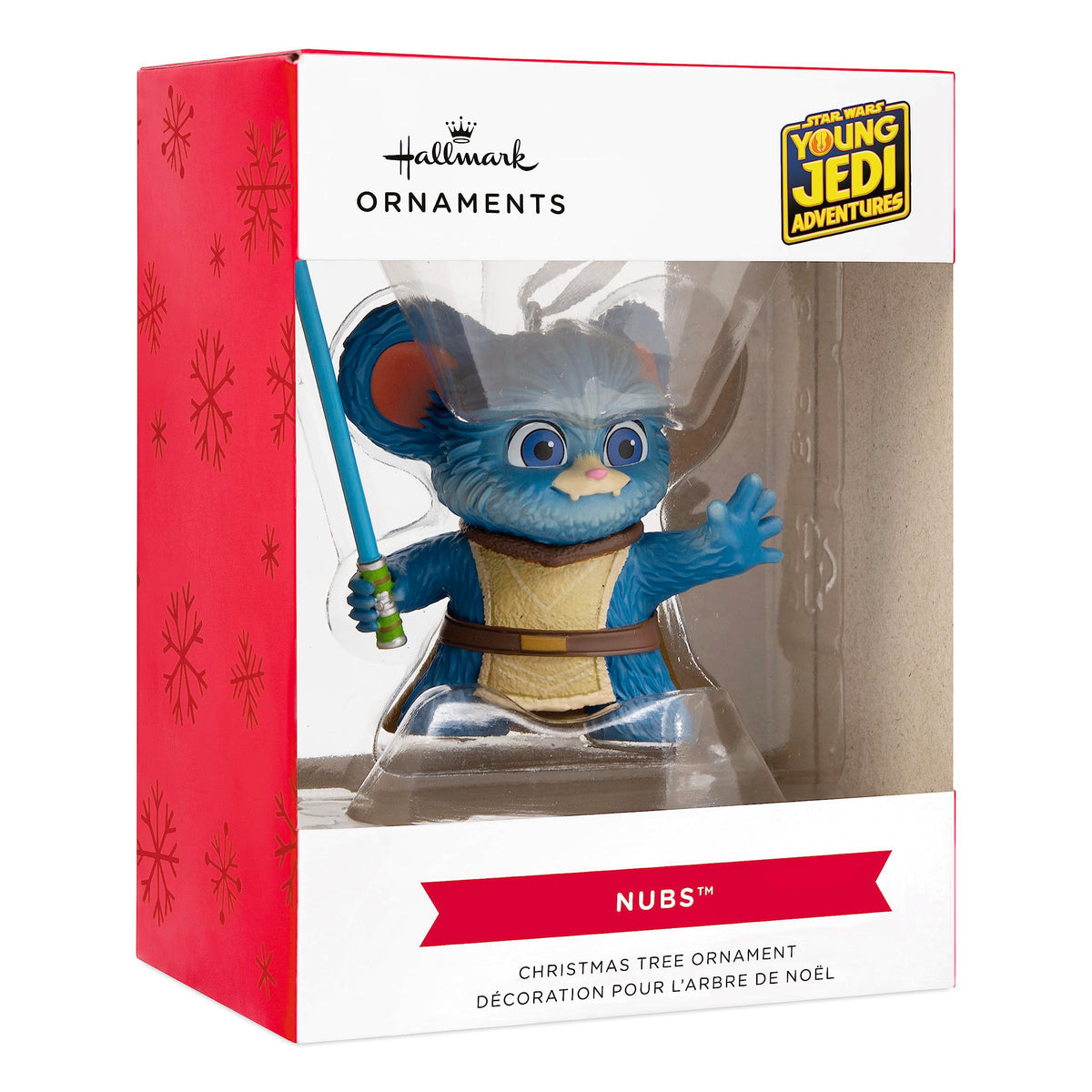 Blue fuzzy creature ornament in its red and white snowflake window box