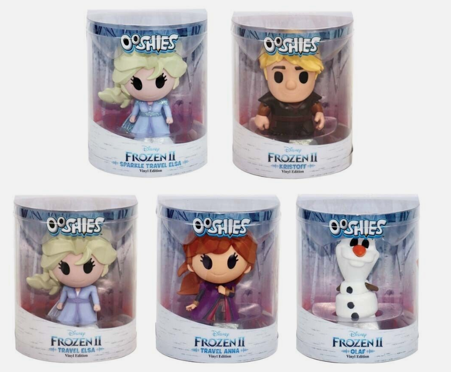 Five boxed vinyl figures: two blonde travel heroines, an ice harvester, a red-haired sister and a snowman
