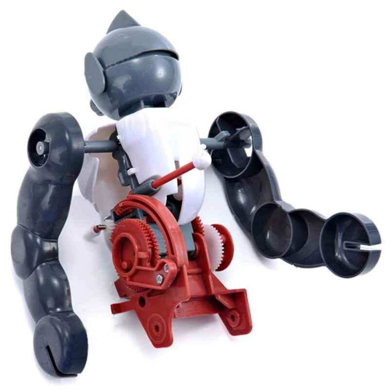 Partly built tumbling robot with gray arms, white body and red gearbox