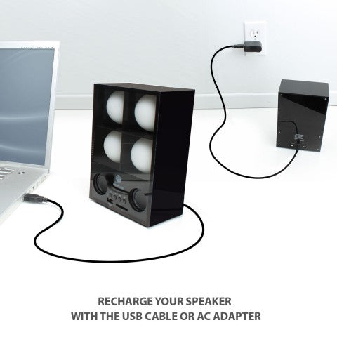 Speaker charging by USB from a laptop, with the satellite unit plugged into a wall outlet