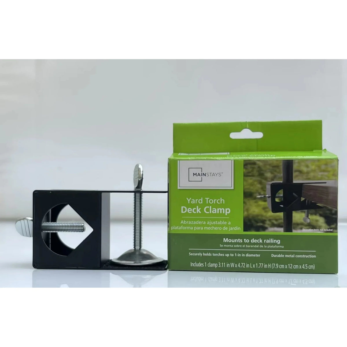 Black metal yard torch deck clamp with thumbscrews beside its green box