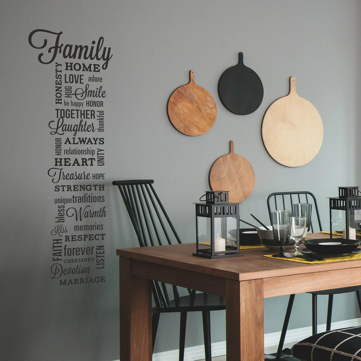 Tall column of black word decals around Family on a grey dining room wall